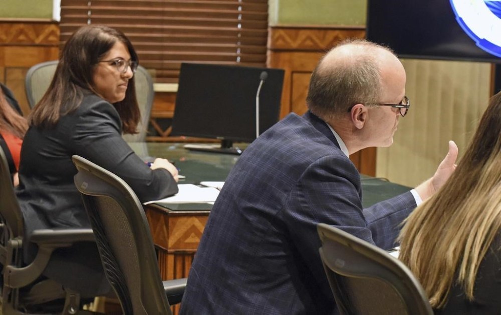 FILE - North Dakota Special Assistant Attorney General Dan Gaustad, right, argues before South Central District Judge Bruce Romanick, not pictured, during a hearing, Dec. 20, 2023, in Bismarck, N.D, over the state's revised abortion laws. At left is Meetra Mehdizadeh, attorney for the Center for Reproductive Rights, who argued on behalf of the Red River Women's Clinic, which has sued over the abortion ban. A North Dakota judge on Tuesday, Jan. 23, 2024, denied a temporary block on a part of the state's revised abortion laws so that doctors can perform the procedure to save a patient's life or health. (Tom Stromme/The Bismarck Tribune via AP, File)