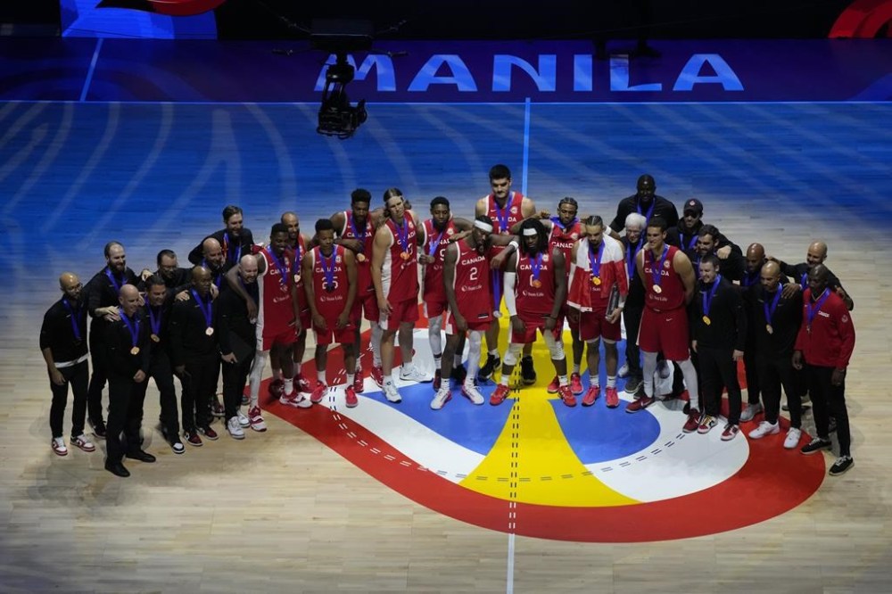 Canada's senior men's basketball team will have an early test leading up to the 2024 Paris Olympics. Canada team members celebrate after the Basketball World Cup bronze medal game between the United States and Canada in Manila, Philippines, Sunday, Sept. 10, 2023. THE CANADIAN PRESS/AP/Aaron Favila