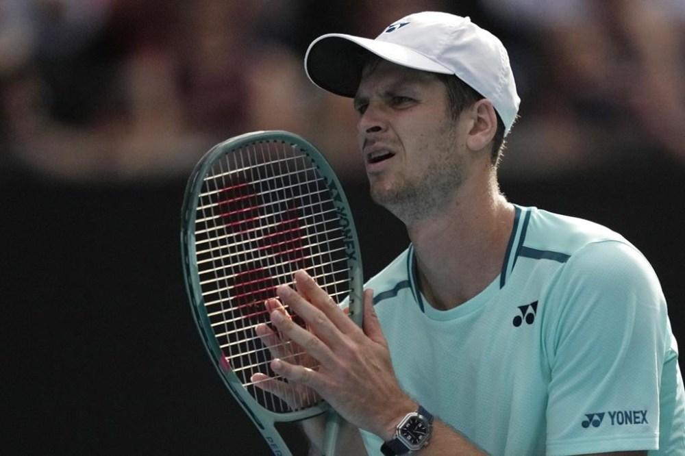 Hubert Hurkacz of Poland reacts during his quarterfinal match against Daniil Medvedev of Russia at the Australian Open tennis championships at Melbourne Park, Melbourne, Australia, Wednesday, Jan. 24, 2024. (AP Photo/Louise Delmotte)