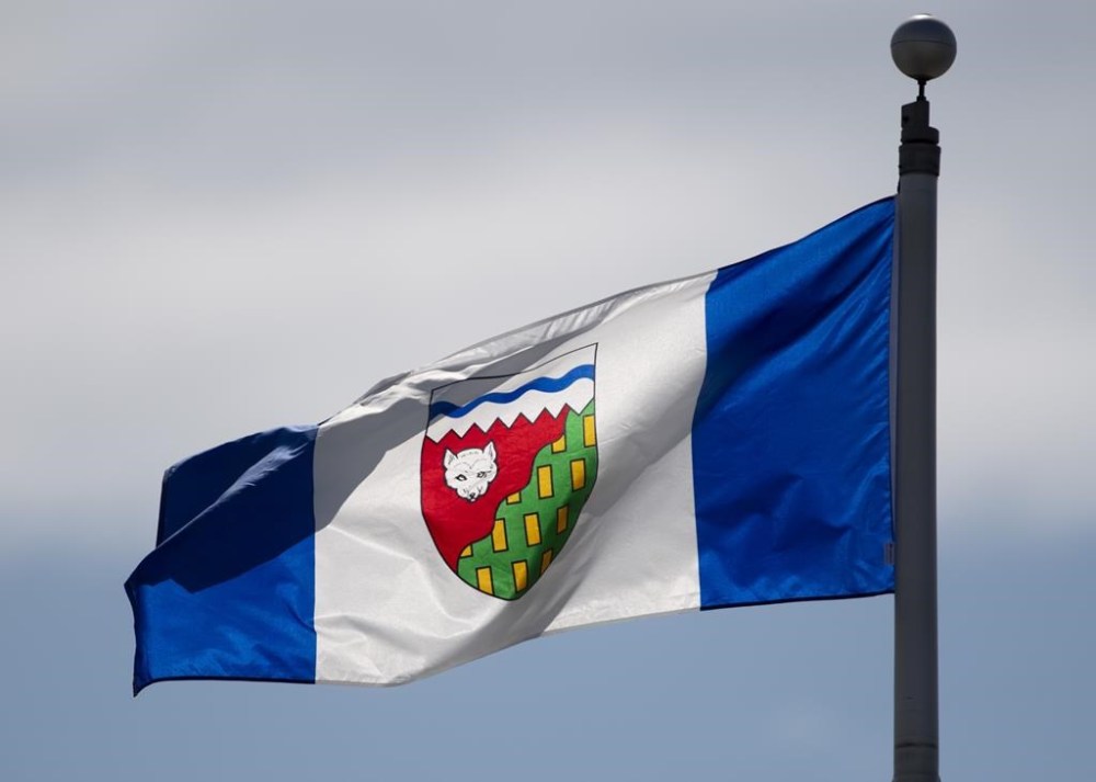 Four passengers and two crew members are dead after a plane crashed shortly after takeoff from Fort Smith, N.W.T. A lone survivor was taken to hospital. The Northwest Territories flag flies on a flag pole in Ottawa on June 30, 2020. THE CANADIAN PRESS/Adrian Wyld