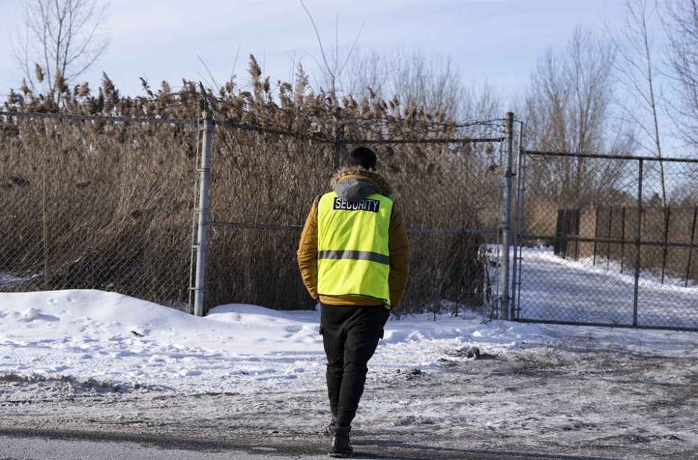 A Quebec Superior Court judge has refused to grant an injunction to halt tree cutting and other preparatory work at the site of a future electric vehicle facility southeast of Montreal. Security guards the entrance to the construction site of the new EV battery plant, Northvolt, in Saint-Basile-le-Grand, east of Montreal, Quebec, Friday, Jan. 19, 2024. THE CANADIAN PRESS/Christinne Muschi