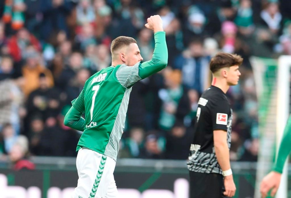 Bremen's Marvin Ducksch celebrates scoring during the Bundesliga soccer match between Werder Bremen and SC Freiburg in Bremen, Germany, Saturday Jan. 27, 2024. (Carmen Jaspersen/dpa via AP)