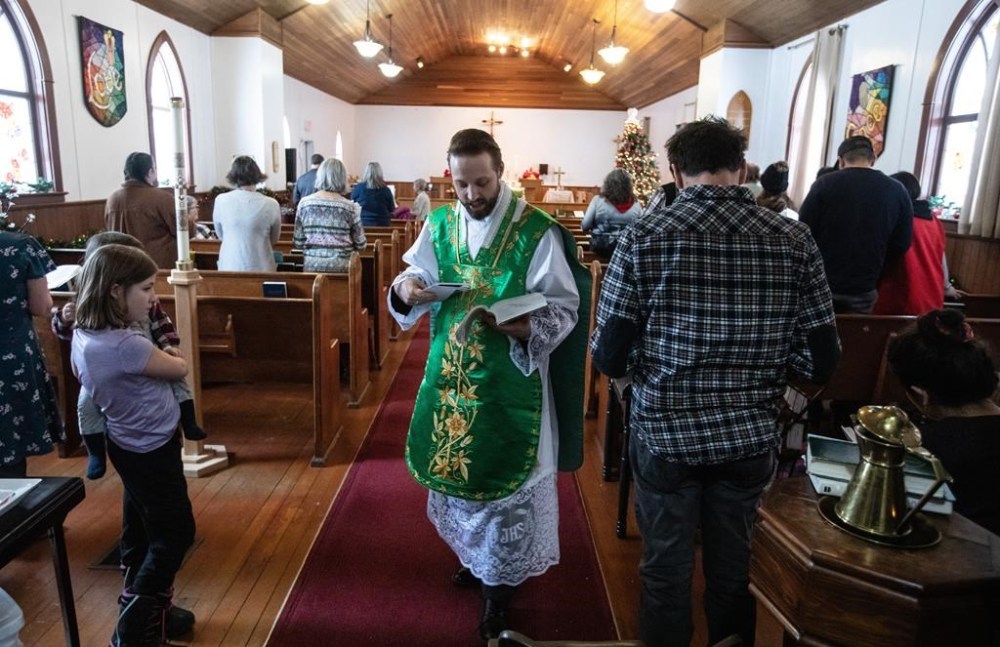 Father Aaron Solberg holds a Sunday service after six people were killed in a plane crash on Tuesday, in Fort Smith, N.W.T., Sunday, Jan. 28, 2024. THE CANADIAN PRESS/Jason Franson