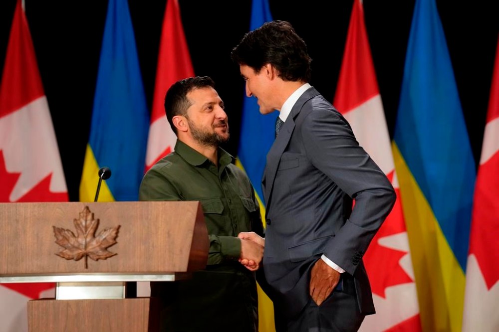 Ukrainian President Volodymyr Zelenskyy, left, and Prime Minister Justin Trudeau shake hands at a joint press conference on Parliament Hill in Ottawa on Friday, Sept. 22, 2023. The Liberals intend to move quickly to get a Ukraine free-trade bill back up for debate and pressure the Conservatives to support it as MPs return to the House of Commons today following the Christmas break. THE CANADIAN PRESS/Adrian Wyld