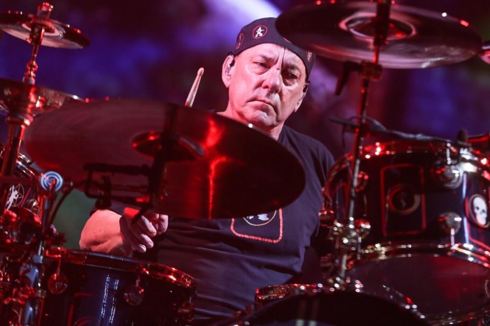 The late drummer for Canadian rock band Rush, Neil Peart, has his final book, celebrating his lifelong passion for collecting cars, set for release this spring. Peart performs during the final show of the R40 Tour at The Forum on Saturday, Aug. 1, 2015, in Los Angeles. THE CANADIAN PRESS/AP-Invision, Rich Fury