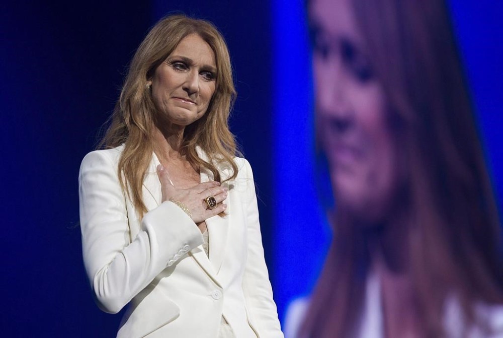 Celine Dion gestures as she performs at the Bell Centre in Montreal, Sunday, July 31, 2016. Dion will reveal her battle with a rare neurological disorder in a new documentary.THE CANADIAN PRESS/Graham Hughes