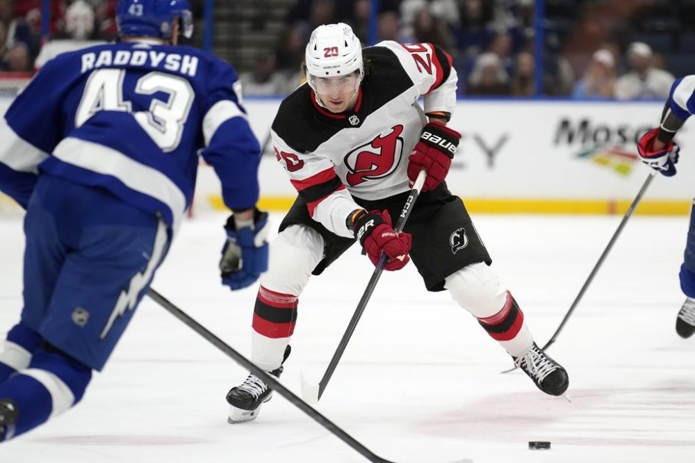 Lawyers for New Jersey Devils forward Michael McLeod say he has been charged with sexual assault and that he will plead not guilty. McLeod (20) carries the puck against Tampa Bay Lightning defenceman Darren Raddysh (43) during the first period of an NHL hockey game, in Tampa, Fla., Thursday, Jan. 11, 2024. THE CANADIAN PRESS/AP-Chris O'Meara