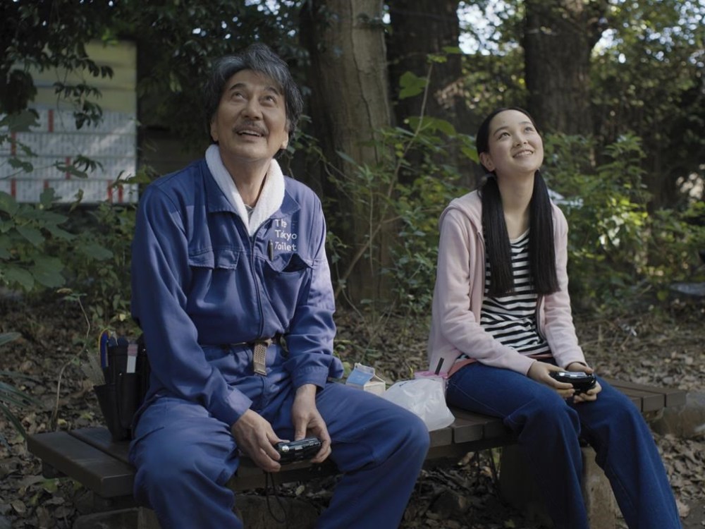 This image released by Neon shows Kôji Yakusho, left, and Arisa Nakano in a scene from