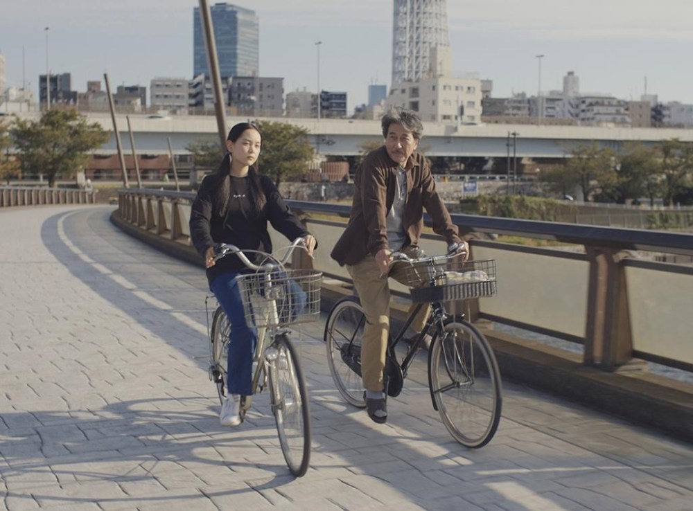 This image released by Neon shows Kôji Yakusho, right, and Arisa Nakano in a scene from