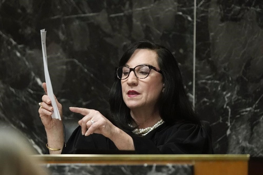 Judge Cheryl Matthews gives the jury instructions, Monday, Feb. 5, 2024 in Pontiac, Mich. The jury received instructions from a judge and begin deliberations in an unusual trial against a school shooter's mother. The deliberations beginning Monday could send Jennifer Crumbley to prison if she is convicted of contributing to the deaths of four students in 2021. (AP Photo/Carlos Osorio, Pool)