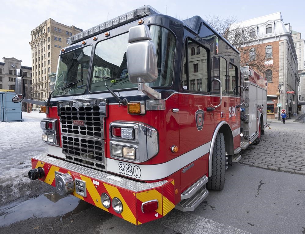 A Montreal fire department truck is seen Tuesday, March 21, 2023, in Montreal. Montreal police are investigating four arsons targeting businesses set in the span of two hours early this morning. THE CANADIAN PRESS/Ryan Remiorz