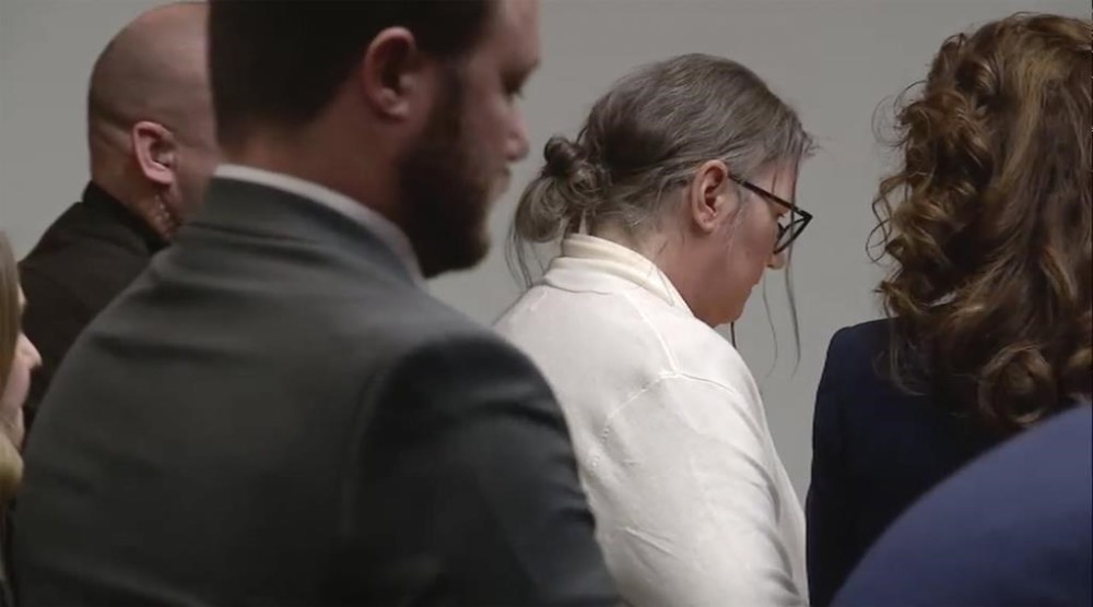 Jennifer Crumbley is taken into custody after a guilty verdict was read on Tuesday, Feb. 6, 2024 in Pontiac, Mich. The jury convicted Crumbley of involuntary manslaughter in a first-of-its-kind trial to determine whether she had any responsibility in the deaths of four students in 2021. Prosecutors say Jennifer Crumbley was grossly negligent when she failed to tell Oxford High School that the family had guns, including a 9 mm handgun that her son, Ethan Crumbley, used at a shooting range on the weekend before the Nov. 30, 2021, attack. (WJBK via AP, Pool)