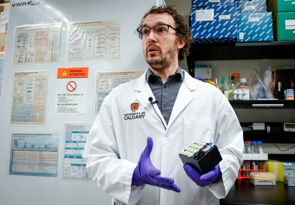 Pierre Billon, an assistant professor of biochemistry and molecular biology at the University of Calgary, explains a point-of-care kit to diagnose genetic mutations, in Calgary, Tuesday, Feb. 6, 2024.THE CANADIAN PRESS/Jeff McIntosh