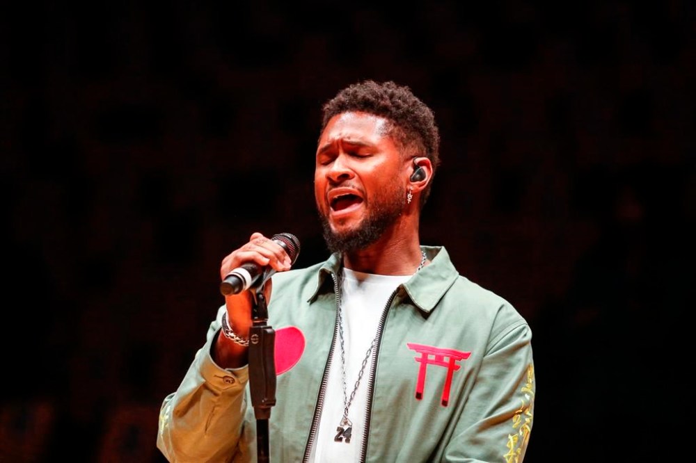 FILE - Singer Usher sings during a rehersal to honor the late Kobe Bryant prior to an NBA game against the Portland Trail Blazers at Staples Center Friday, Jan. 31, 2020, in Los Angeles. (AP Photo/Ringo H.W. Chiu, File)