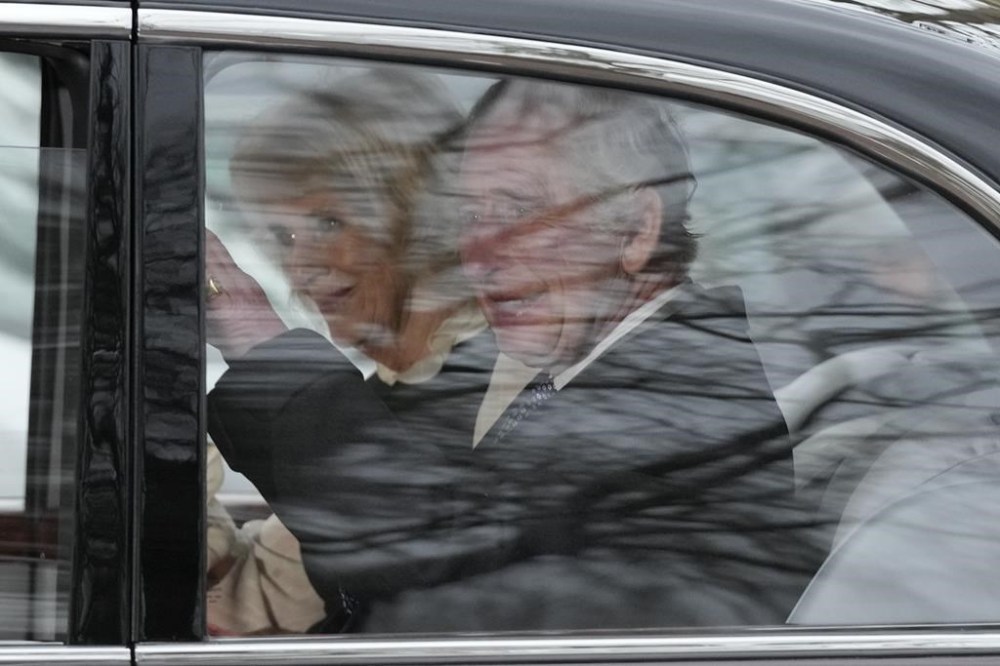 King Charles III waves as he and Queen Camilla leave Clarence House by car in London, Tuesday, Feb. 6, 2024. Buckingham Palace announced Monday evening that the king has begun outpatient treatment for an undisclosed form of cancer. (AP Photo/Frank Augstein)