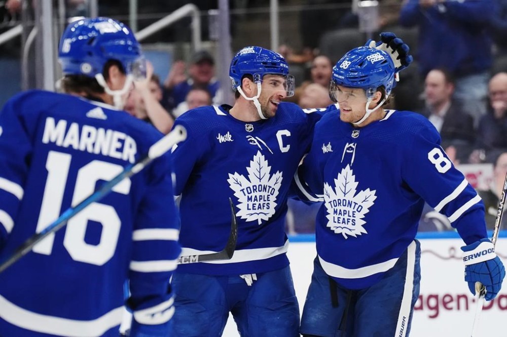 Toronto Maple Leafs forward John Tavares (91) celebrates his goal against the Dallas Stars with forward William Nylander (88) during second period NHL hockey action in Toronto on Wednesday, February 7, 2024. THE CANADIAN PRESS/Nathan Denette