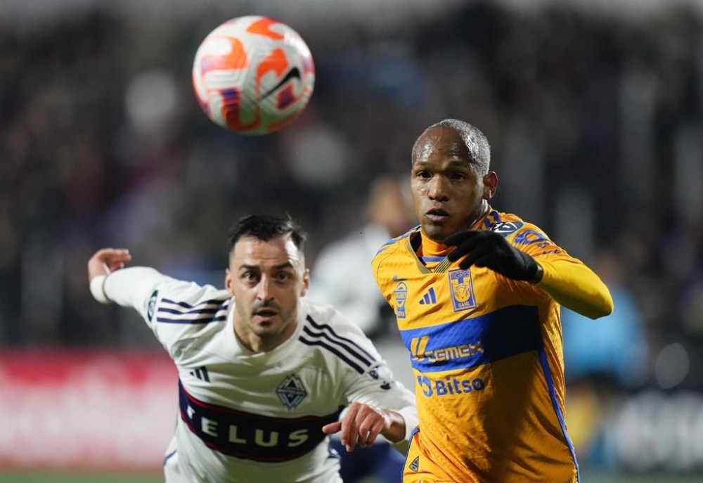 Tigres UANL's Luis Quinones, front right, and Vancouver Whitecaps' Luis Martins vie for the ball during the first half of a CONCACAF Champions Cup soccer match, in Langford, B.C., on Wednesday, February 7, 2024. THE CANADIAN PRESS/Darryl Dyck