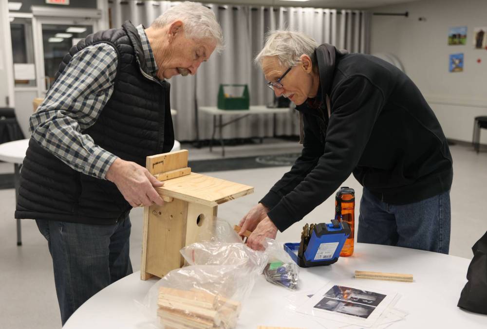 Lloyd McCabe and Larry Grime put the finishing touches on a nest box on Thursday at Seniors for Seniors Co-op Inc. in Brandon. (Michele McDougall/The Brandon Sun)