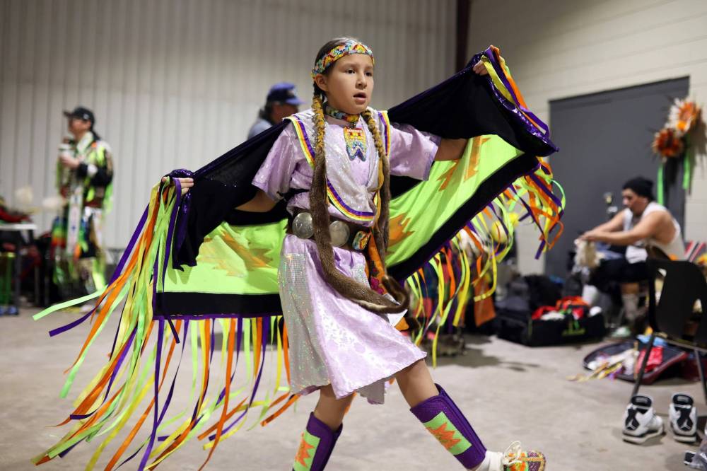 Ten-year-old Emily Kiyewakan dances while waiting to take part in the Powwow Grand Entry. (Tim Smith/The Brandon Sun)