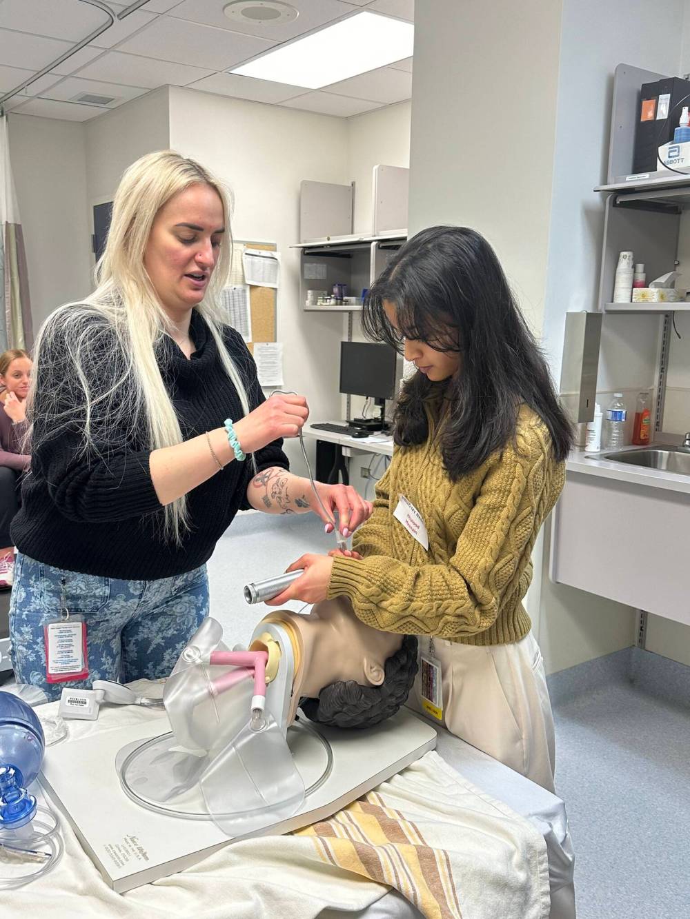 Lana Minuk a respiratory therapist with the Brandon Regional Health Centre, shows the ropes to University of Manitoba medical student Khulood Hasnain.