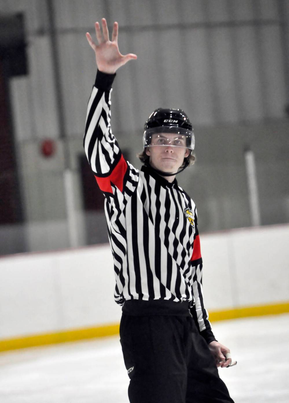 Hockey Manitoba referee Carson McDonald of Brandon has been selected to officiate in the Manitoba Junior Hockey League/Saskatchewan Junior Hockey League showcase being held in Winnipeg. Here, he signals to the benches using the line change procedure during a recent high school game at Flynn Arena.
