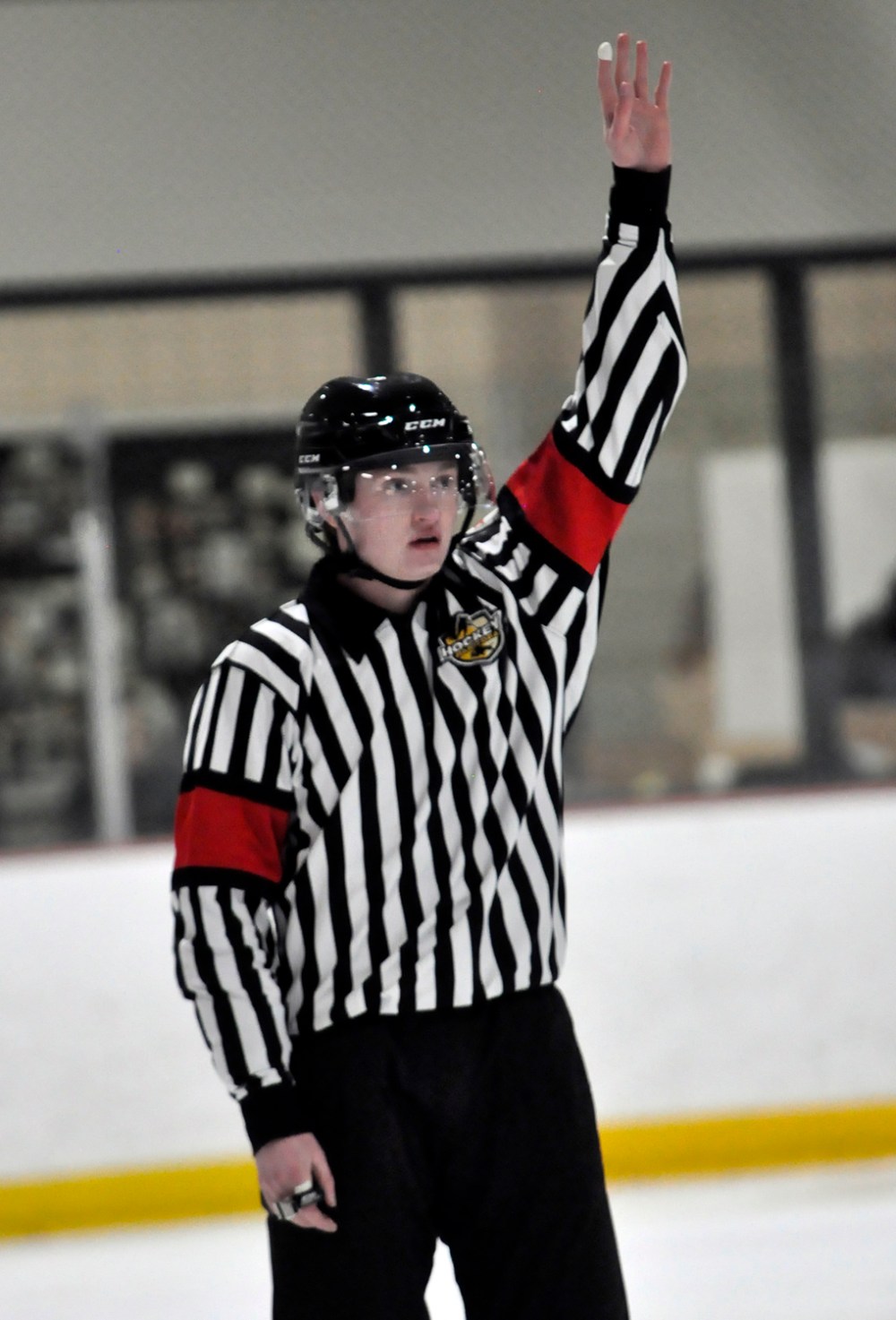 Hockey Manitoba referee Carson McDonald of Brandon has been selected to officiate in the Manitoba Junior Hockey League/Saskatchewan Junior Hockey League showcase being held in Winnipeg. Here, he signals to the benches using the line change procedure during a recent high school game at Flynn Arena.