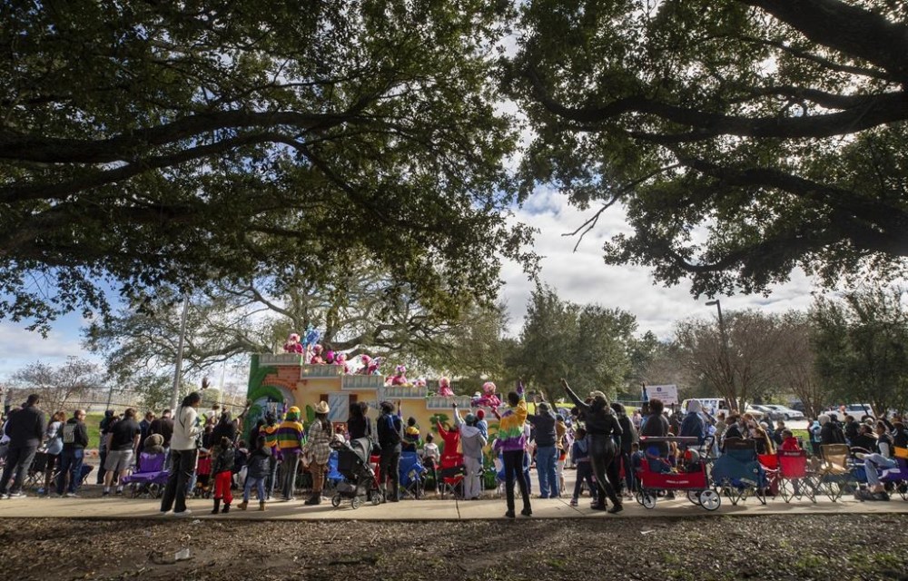 The Krewe of Nefertiti rolls along Lake Forest Blvd. in New Orleans East , Sunday, Jan. 28, 2024. (David Grunfeld/The Times-Picayune/The New Orleans Advocate via AP)
