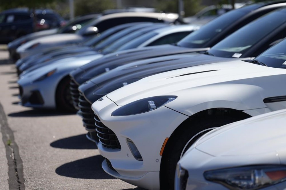 A long line of unsold 2023 luxury sports-utility vehicles and coupes sits at an Aston Martin dealership Sunday, Aug 27, 2023, in Highlands Ranch, Colo. Officials from various levels of government are set to gather with police and industry leaders in Ottawa today to brainstorm on fighting the scourge of automobile theft. THE CANADIAN PRESS/AP, David Zalubowski