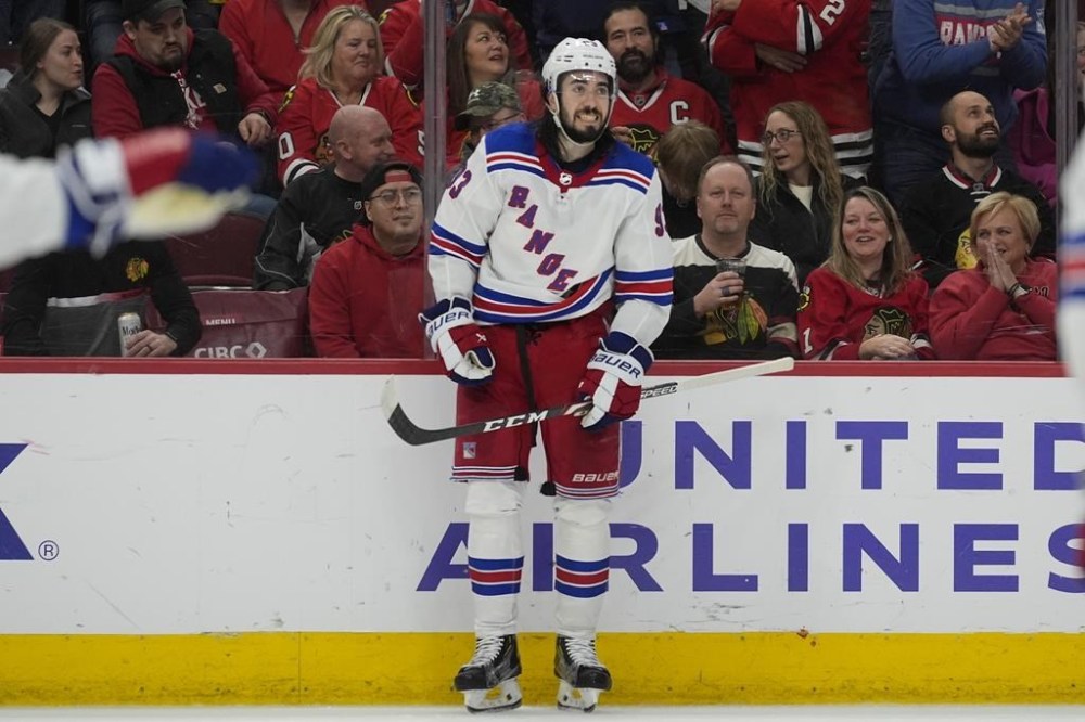 New York Rangers center Mika Zibanejad celebrates his overtime goal against the Chicago Blackhawks in an NHL hockey game, Friday, Feb. 9, 2024, in Chicago. The Rangers won 4-3. (AP Photo/Erin Hooley)