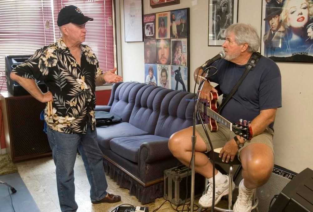 FILE - Travis Wammack, right, talks over a song as he practices with legendary Sun Records drummer J.M. Van Eaton in Tuscumbia, Ala., July 28, 2010. Van Eaton, a pioneering rock ‘n’ roll drummer who played behind the likes of Jerry Lee Lewis and Billy Lee Riley at Sun Records in Memphis, Tenn., died Friday, Feb. 9, 2024, at age 86, a family member said. (Matt McKean/The TimesDaily via AP, File)