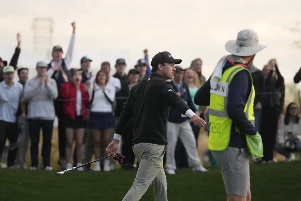 Nick Taylor, of Canada, celebrates a birdie at the fifth hole during the third round of the Phoenix Open golf tournament Saturday, Feb. 10, 2024, in Scottsdale, Ariz. (AP Photo/Ross D. Franklin)