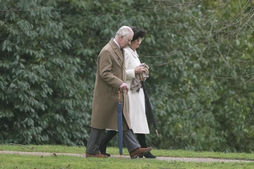 Britain's King Charles III and Queen Camilla arrive to attend a Sunday church service at St Mary Magdalene Church, in Sandringham, Norfolk, England, Sunday, Feb. 11, 2024. (PA via AP)