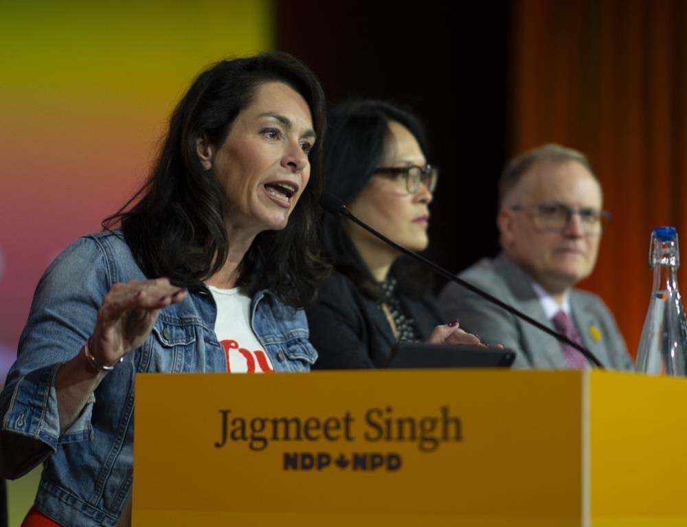 NDP MP and Foreign Affairs Critic Heather McPherson brings calm to the room after a small number of delegates expressed their anger when the conflict with Gaza and Israel became a topic of contention between delegates during the NDP Convention in Hamilton, Ont. Saturday, October 14, 2023. McPherson will table a private member's motion that asks the Commons to recognize the occupied Palestinian territories as a full-fledged state.THE CANADIAN PRESS/Peter Power