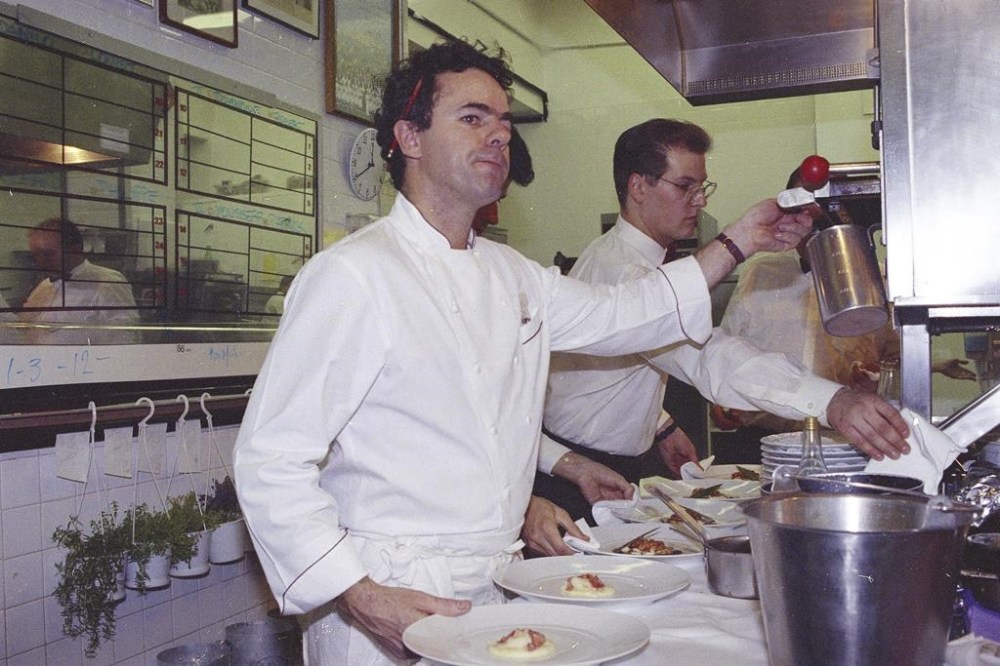 FILE - Chef David Bouley works in the kitchen of his restaurant, Bouley, in New York, Nov. 11, 1991. Bouley, the award-winning and frenetic chef whose idiosyncratic haute cuisine and crusty breads pleased critics and the public during a career chasing sleek deliciousness, died of a heart attack Monday at his home in Kent, Connecticut, according to Lisa Queen, his literary agent. He was 70. (AP Photo/Osamu Honda, File)