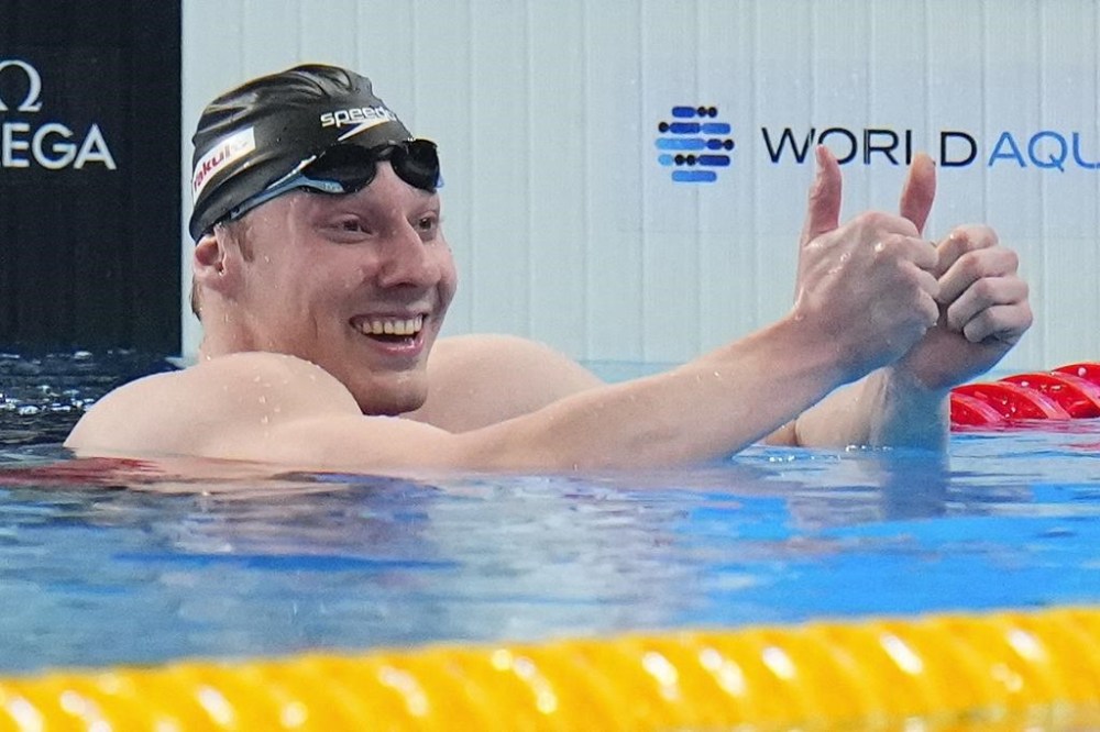 Finlay Knox of Canada celebrates after winning in the men's 200-metre medley final at the World Aquatics Championships in Doha, Qatar, Thursday, Feb. 15, 2024. THE CANADIAN PRESS/AP/Hassan Ammar