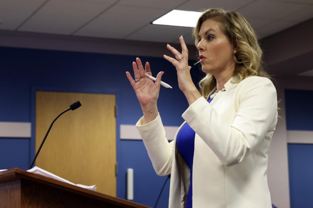 Ashleigh Merchant, attorney for Michael Roman, speaks during a hearing on the Georgia election interference case, Thursday, Feb. 15, 2024, in Atlanta. The hearing is to determine whether Fulton County District Attorney Fani Willis should be removed from the case because of a relationship with Nathan Wade, special prosecutor she hired in the election interference case against former President Donald Trump. (Alyssa Pointer/Pool Photo via AP)