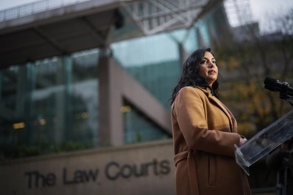 B.C. Attorney General Niki Sharma pauses while responding to questions outside B.C. Supreme Court in Vancouver on Monday, Nov. 27, 2023. The British Columbia Prosecution Service has revised its hate crimes policy, expanding definitions and guidance related to hate-motivated offences. THE CANADIAN PRESS/Darryl Dyck