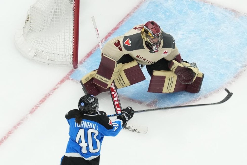Toronto's Blayre Turnbull shoots at Montreal goaltender Ann-Renee Desbiens during first period PWHL hockey action, in Toronto, on Friday, February 16, 2024. THE CANADIAN PRESS/Chris Young