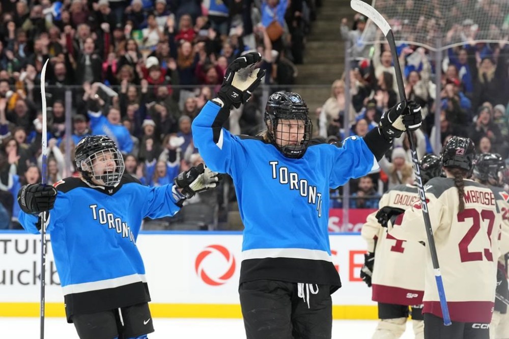 Toronto's Hannah Miller (centre) celebrates after scoring against Montreal during third period PWHL hockey action, in Toronto, on Friday, February 16, 2024. THE CANADIAN PRESS/Chris Young