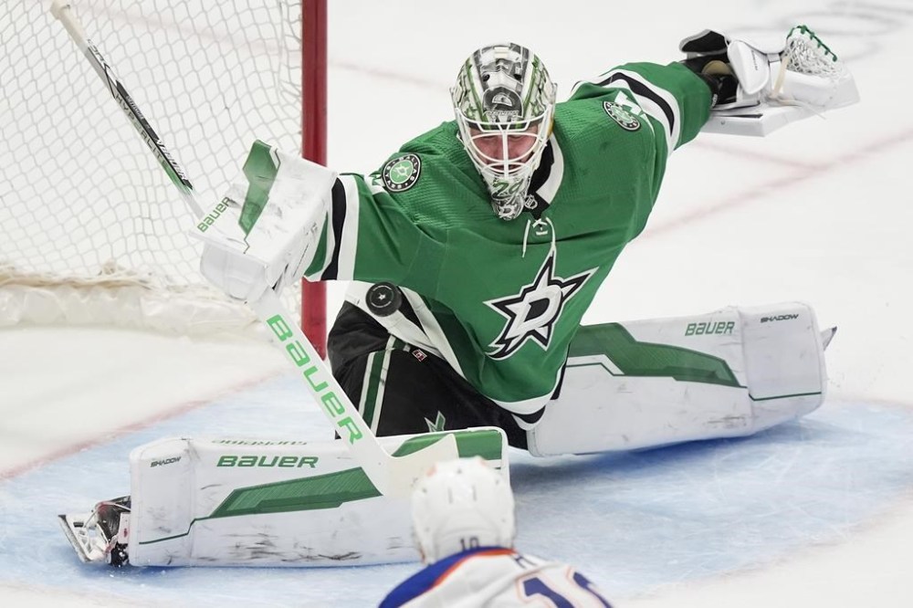 Edmonton Oilers center Derek Ryan (10) scores a goal against Dallas Stars goalie Jake Oettinger during the second period an NHL hockey game in Dallas, Saturday, Feb. 17, 2024. (AP Photo/LM Otero)