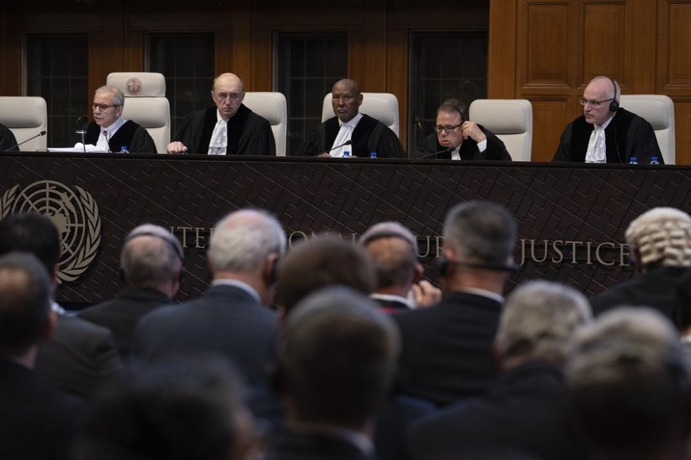 The United Nations' highest court with presiding judge Nawaf Salam, left, opening historic hearings in The Hague, Netherlands, Monday, Feb. 19, 2024. ix days of hearings opened Monday at the top United Nations court into the legality of Israel’s 57-year occupation of lands sought for a Palestinian state. (AP Photo/Peter Dejong)