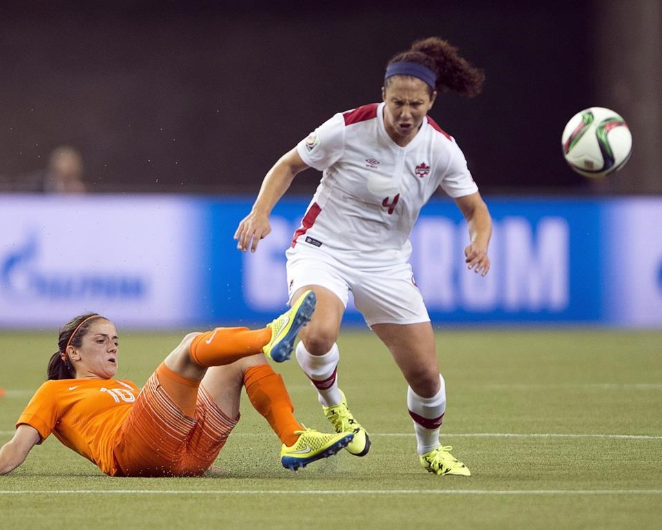 Canadian Carmelina Moscato has joined the NWSL's Racing Louisville FC as an assistant coach. Moscato battles Netherlands' Danielle Van De Donk during first-half Women's World Cup soccer in Montreal, Monday, June 15, 2015. THE CANADIAN PRESS/Ryan Remiorz