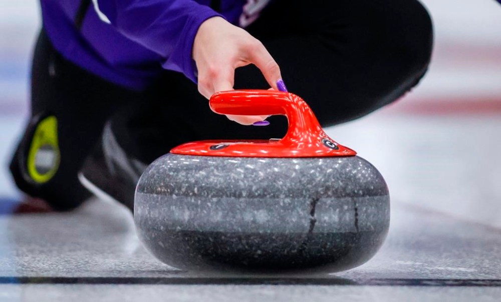 A rock crosses the hog line at the Scotties Tournament of Hearts in Calgary, Monday, Feb. 19, 2024. The honour system is in play at the Canadian women's curling championship when it comes to hog-line violations. THE CANADIAN PRESS/Jeff McIntosh