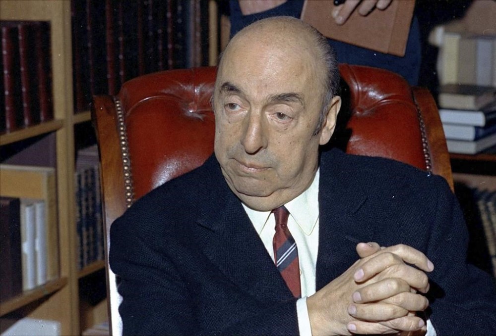 FILE - Nobel Prize-winning poet Pablo Neruda sits in Paris in October 1971. An appeals court in Chile’s capital ruled Tuesday, Feb. 20, 2024, that the case of Neruda's death be reopened, saying the investigation has not been exhausted and new steps could help clarify the cause of his death. Last December, a judge rejected a request by Neruda's nephew to reopen the case to look for other causes of death than cancer, which is what is listed on the poet’s death certificate. (AP Photo/Michel Lipchitz, File)