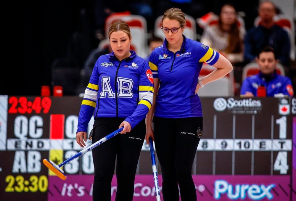 Team Alberta skip Selena Sturmay, left, and vice-skip Danielle Schmeimann discuss strategy as they play Team Quebec at the Scotties Tournament of Hearts in Calgary, Tuesday, Feb. 20, 2024. THE CANADIAN PRESS/Jeff McIntosh