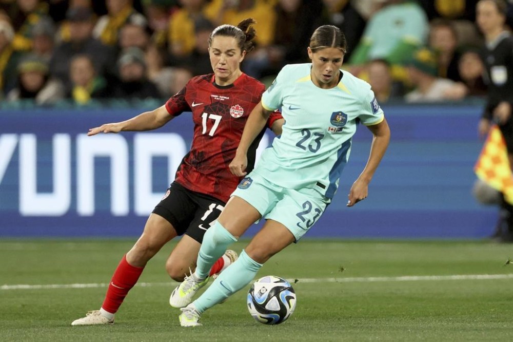 Canada's Jessie Fleming vies for the ball with Australia's Kyra Cooney-Cross, right, during the Women's World Cup Group B soccer match between Australia and Canada in Melbourne, Australia, Monday, July 31, 2023. Fleming has been Canada captain ahead of the CONCACAF W Gold Cup. THE CANADIAN PRESS/AP-Hamish Blair