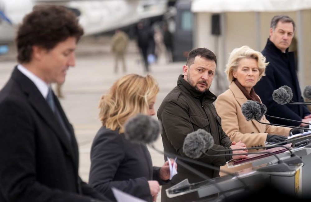 Ukrainian President Volodymyr Zelenskyy listens as Prime Minister Justin Trudeau speaks during a ceremony at Hostomel Airport in Kyiv, Ukraine on Saturday, February 24, 2024. The ceremony marking the Russian invasion's second anniversary also included Italian Prime Minister Giorgia Meloni (second from left), European Commission President Ursula von der Leyen (second from right) and Belgian Prime Minister Alexander De Croo (right). THE CANADIAN PRESS/Nathan Denette