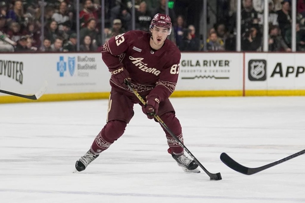 FILE - Arizona Coyotes' Adam Ruzicka (83) during an NHL hockey game against the Minnesota Wild Wednesday, Feb. 14, 2024, in Tempe, Ariz. The Coyotes put forward Ruzicka on unconditional waivers Friday, Feb. 23, to terminate his contract. (AP Photo/Darryl Webb)