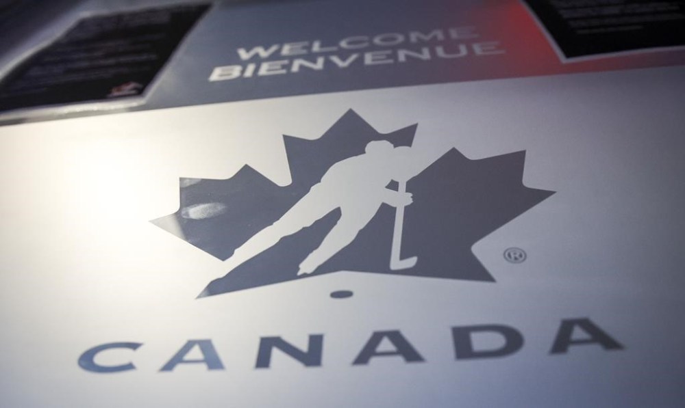 A Hockey Canada logo is seen on the door to the organizations head office in Calgary, Alta., Sunday, Nov. 6, 2022. Hockey Canada says Alberta will host the world junior hockey championship in 2027. THE CANADIAN PRESS/Jeff McIntosh
