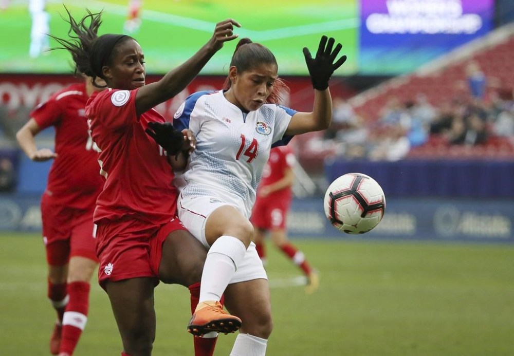 Canada forward Nichelle Price, front left, attempts to control the ball near Panama defender Maryorie Perez (14) during the second half of a soccer match at the CONCACAF women's World Cup qualifying tournament in Frisco, Texas, Sunday, Oct. 14, 2018. THE CANADIAN PRESS/AP-Andy Jacobsohn
